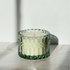 holiday candle in mint colored antique-style chunky glass vessel. beautiful candle.