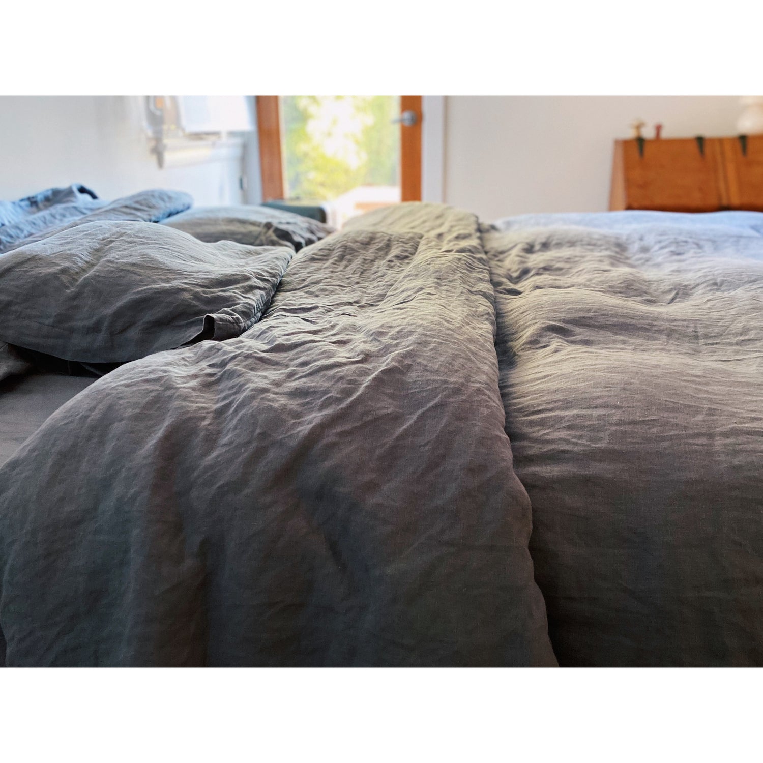 bed with hemp bedding in a muted navy color