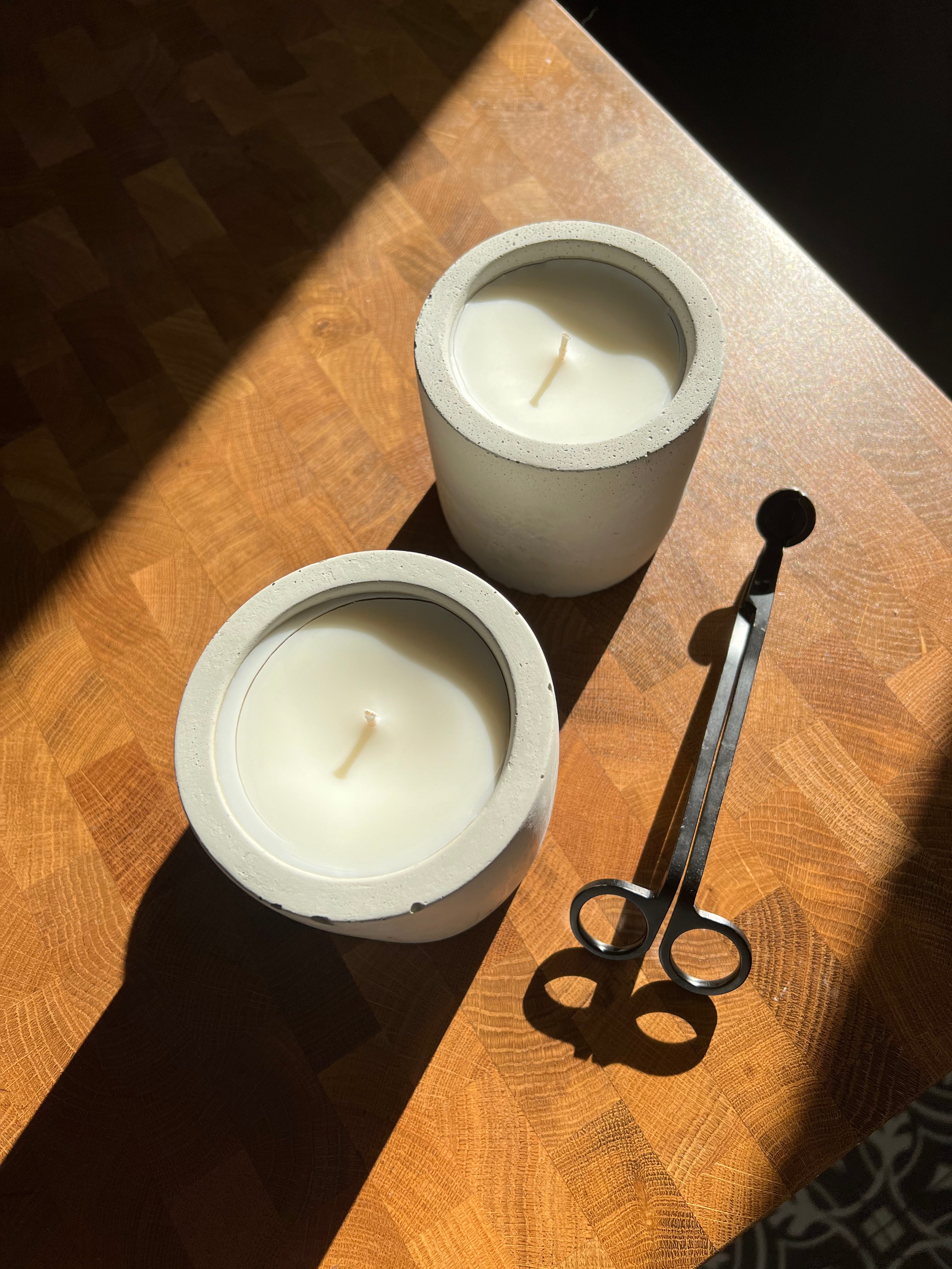 two concrete candles with a smooth finish